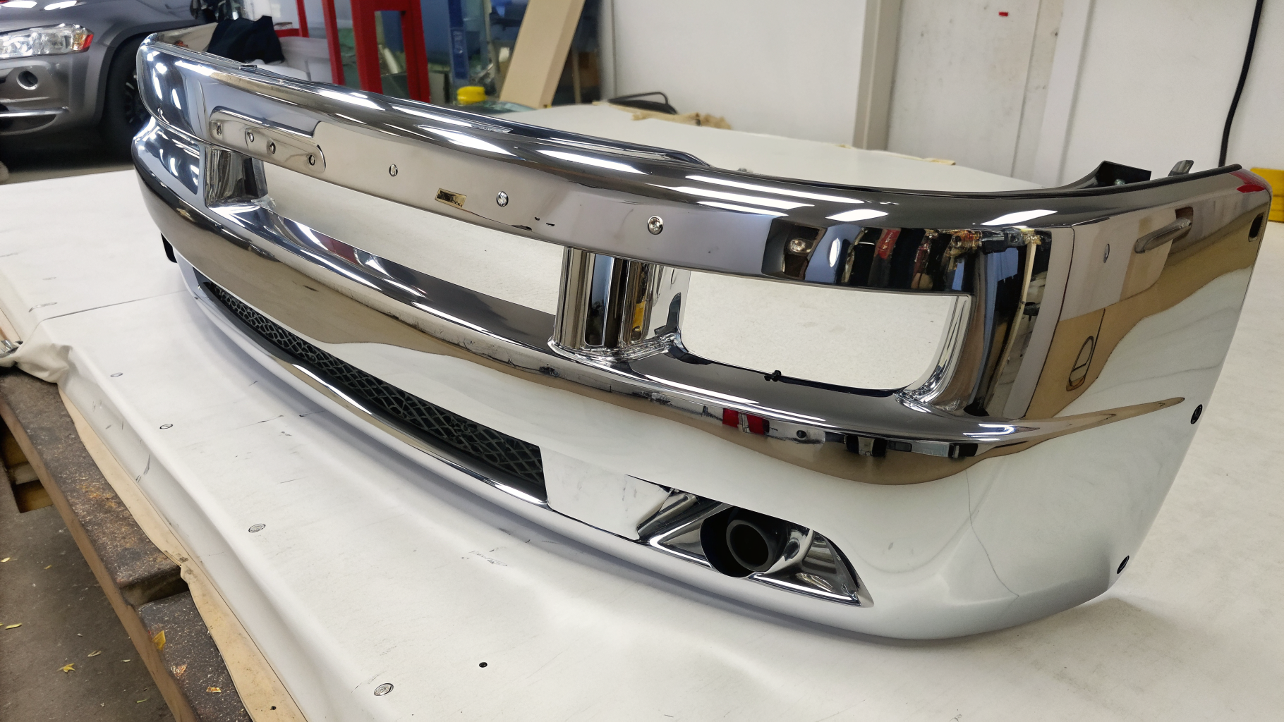 Freshly re-plated chrome bumper with a mirror finish after industrial chrome plating