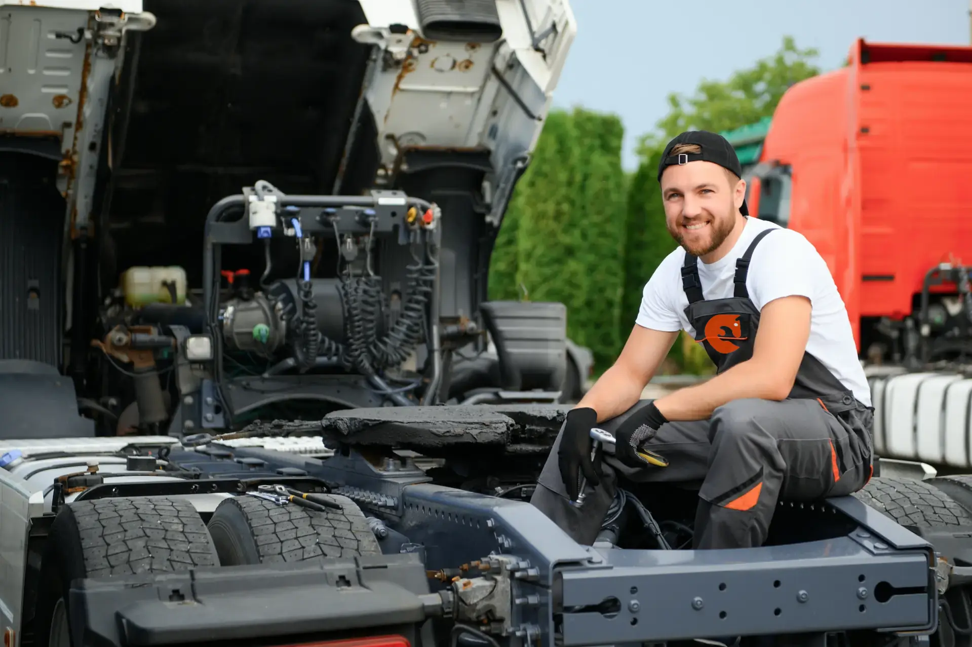 Professional automotive garage with vehicle on hydraulic lift and diagnostic tools, no humans appears in the image