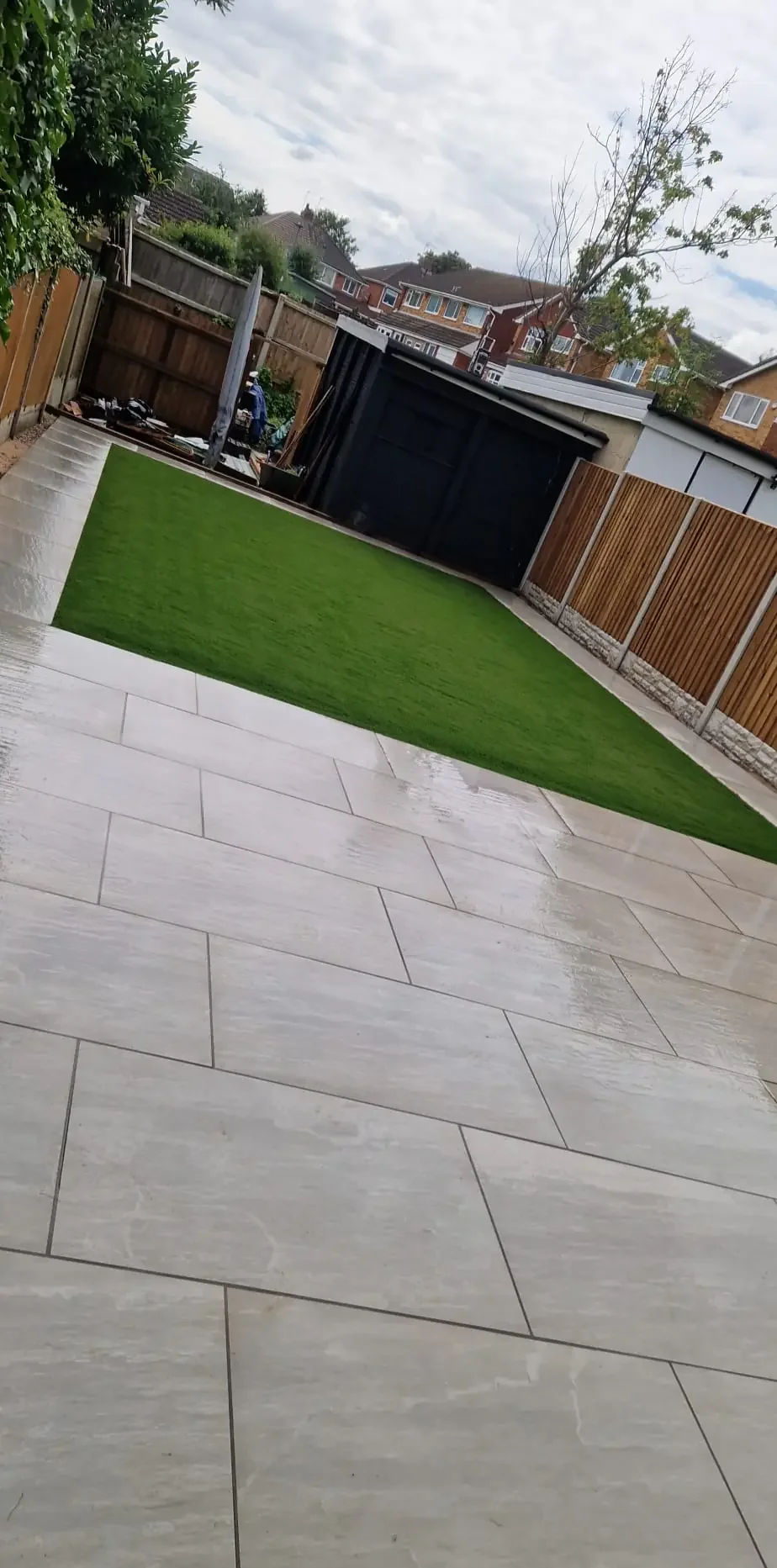 Porcelain Patio Leading to Artificial Lawn