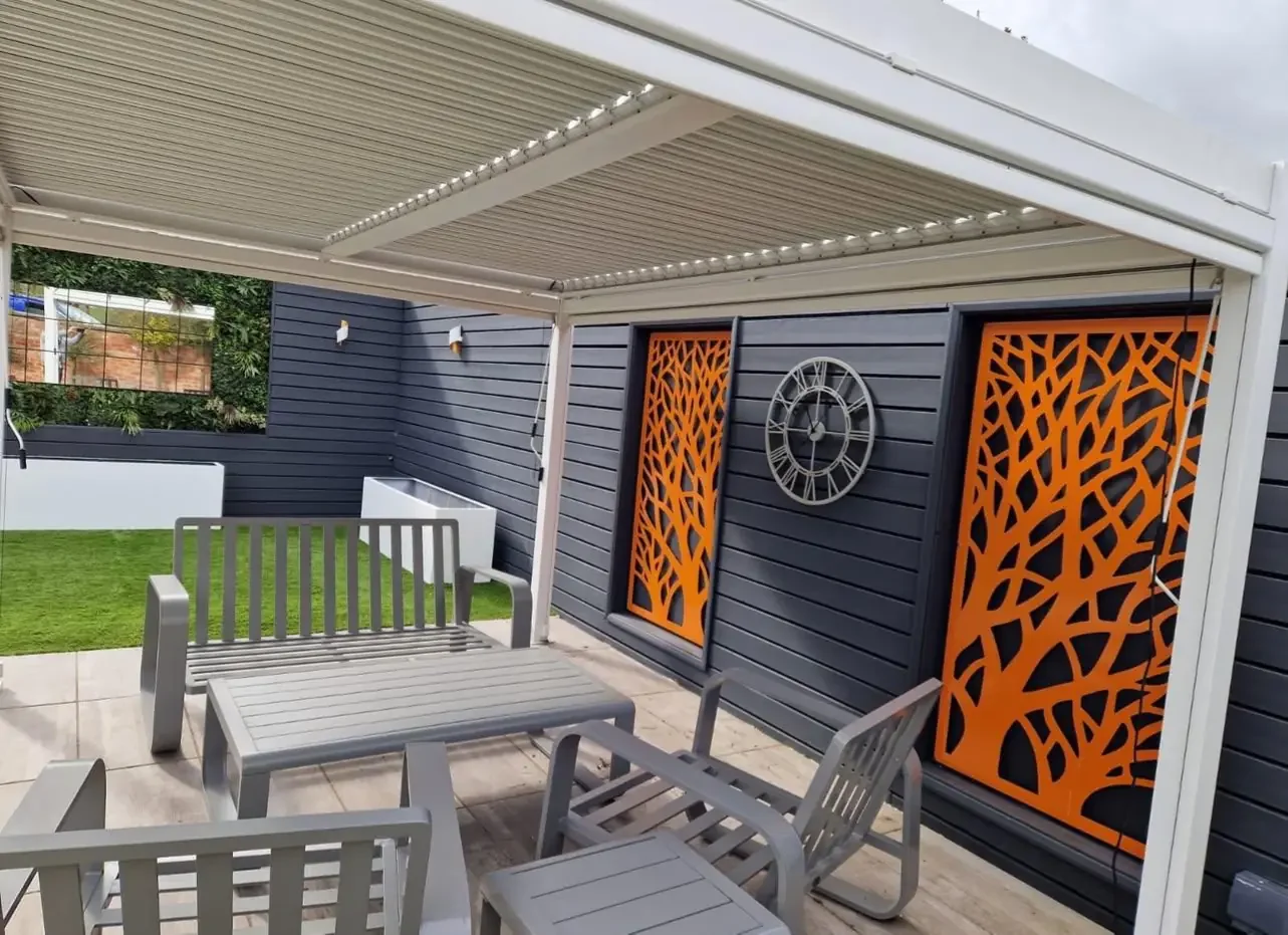 Modern Covered Garden Seating Area with Feature Wall